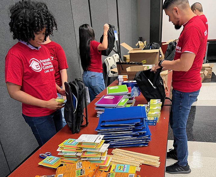 volunteers packing backpacks